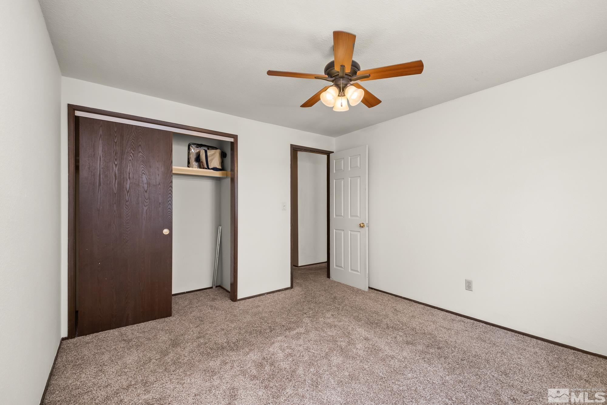 560 Peter Reno, NV 89503 - Photo 18 of 21 a view of a livingroom with a ceiling fan and window
