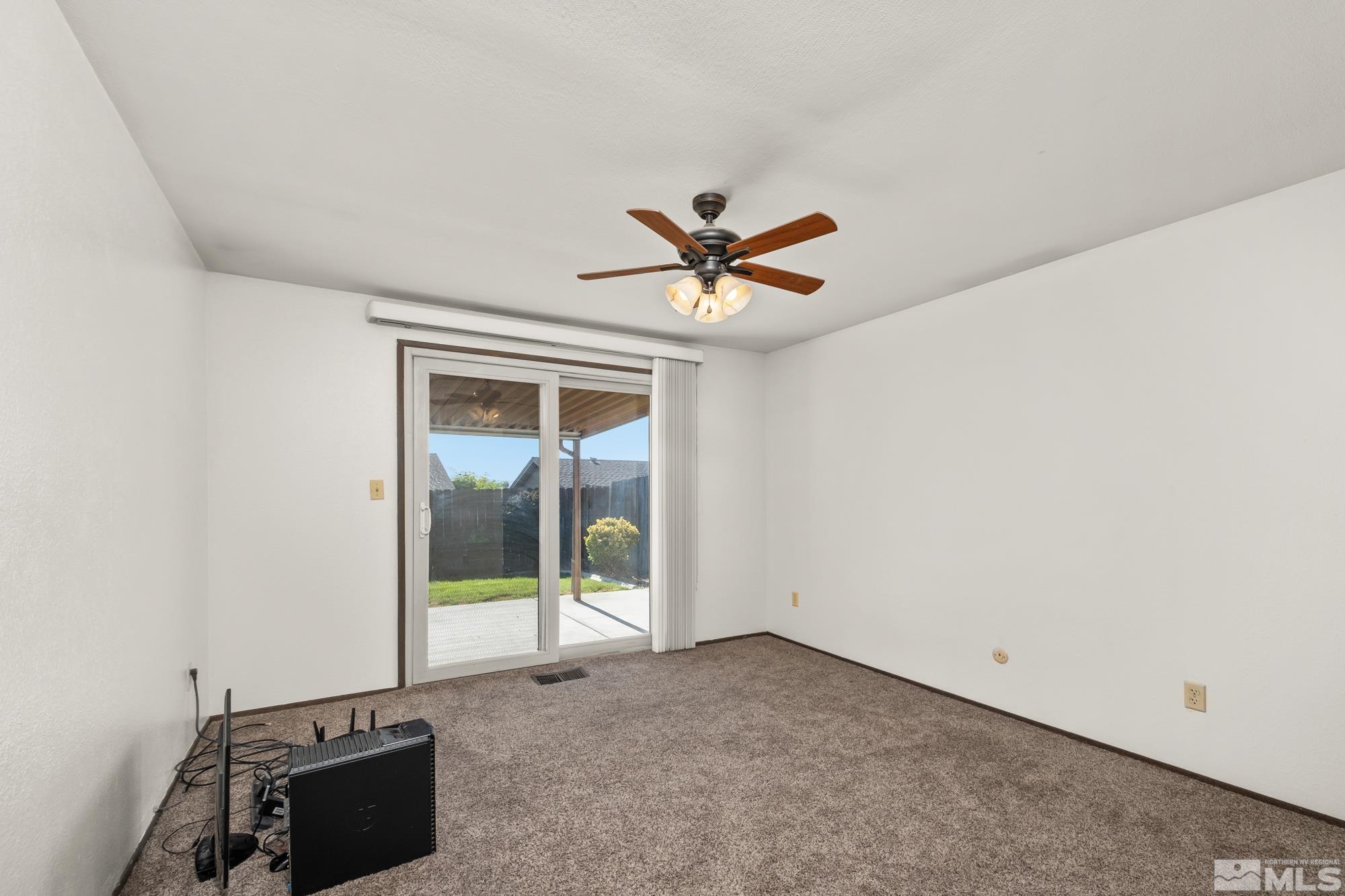560 Peter Reno, NV 89503 - Photo 19 of 21 an empty room with a ceiling fan and window