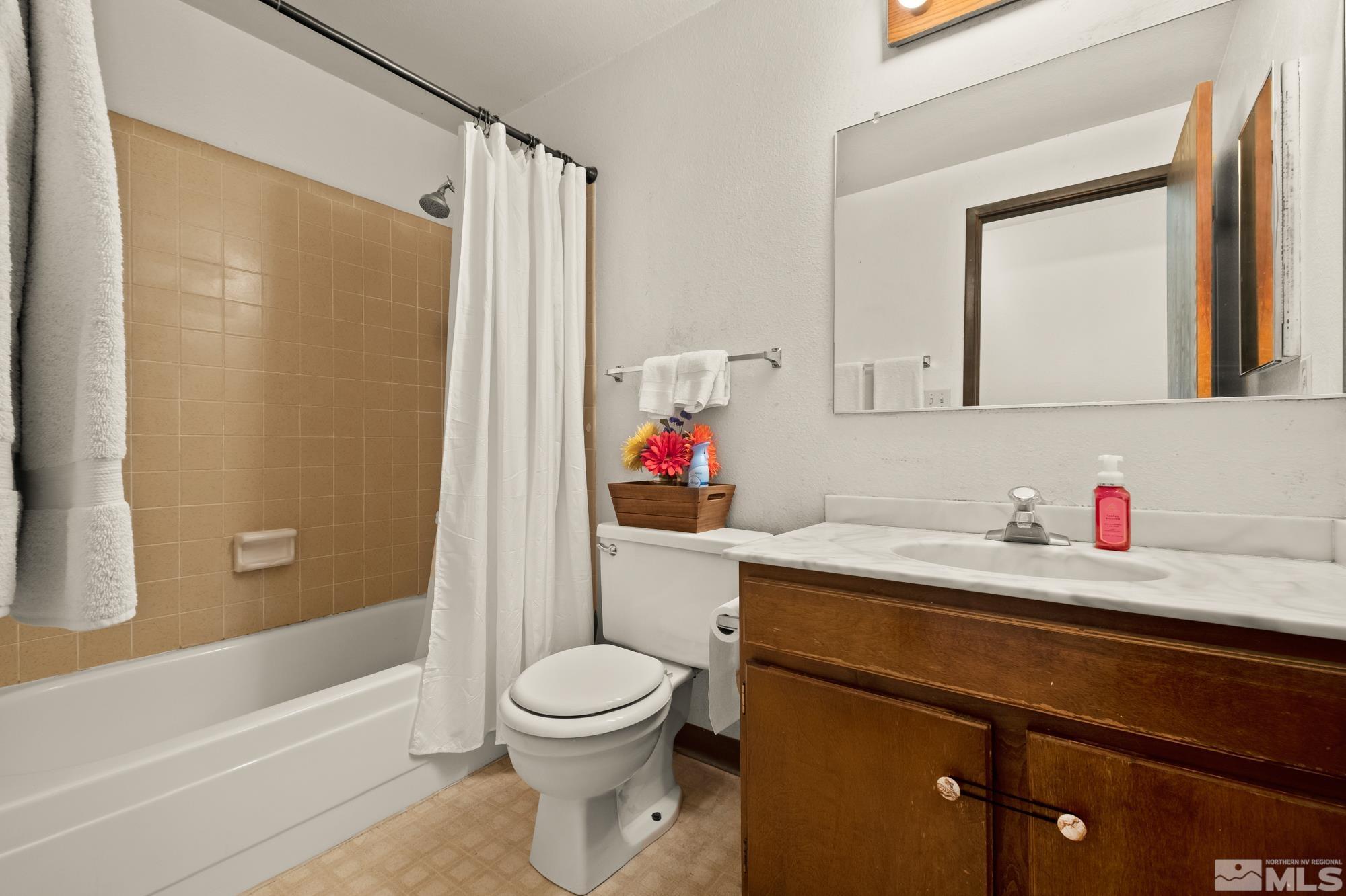 560 Peter Reno, NV 89503 - Photo 20 of 21 a bathroom with a sink a toilet and shower