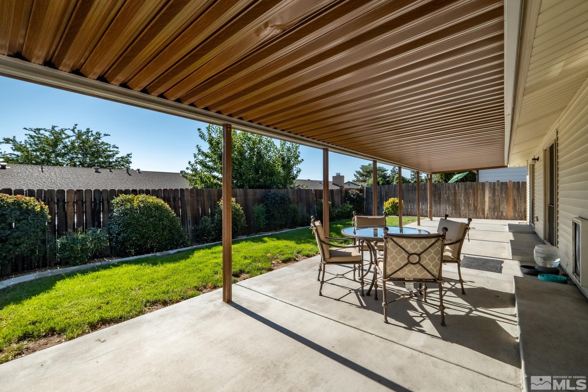 560 Peter Reno, NV 89503 - Photo 4 of 21 a view of a patio with table and chairs potted plants and floor to ceiling window