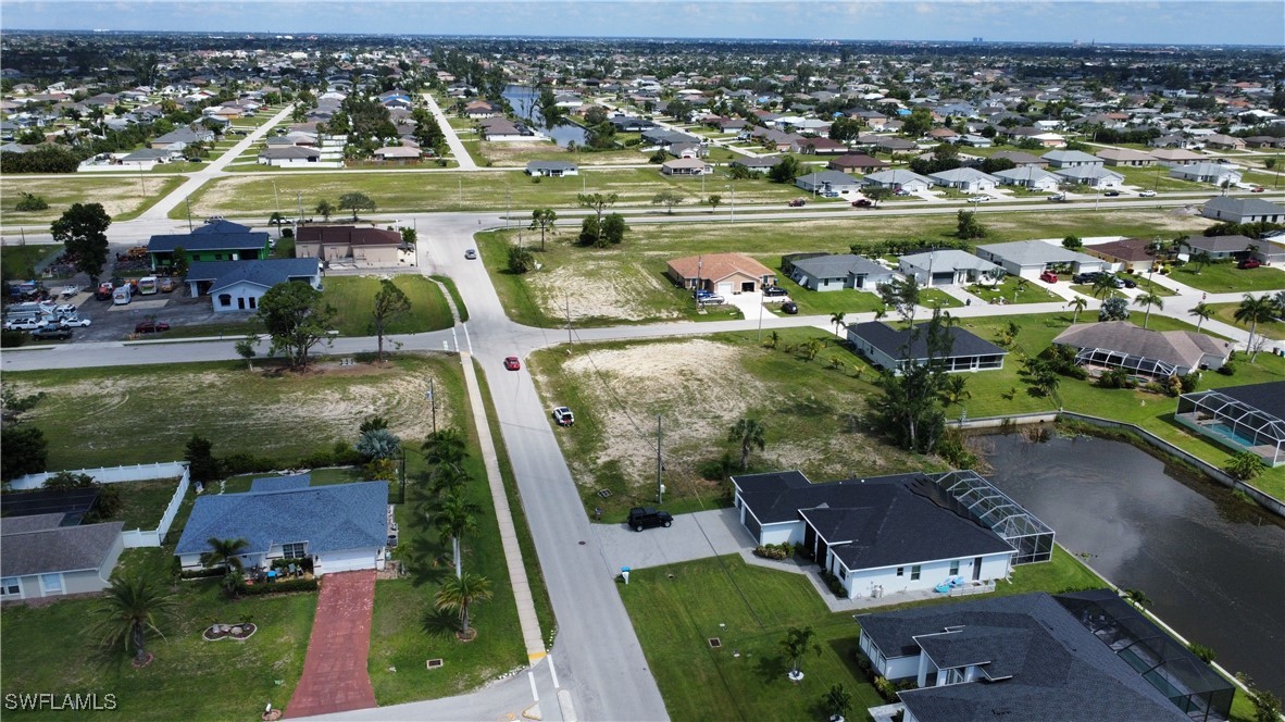 820 Southwest 28th Street Cape Coral, FL 33914 - Photo 3 of 17 an aerial view of residential houses with outdoor space and swimming pool