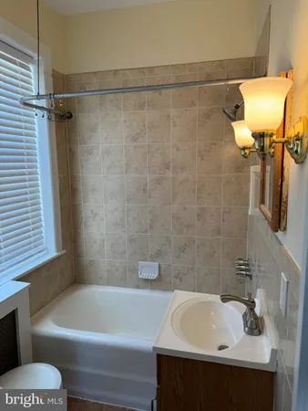a bathroom with a sink and bathtub