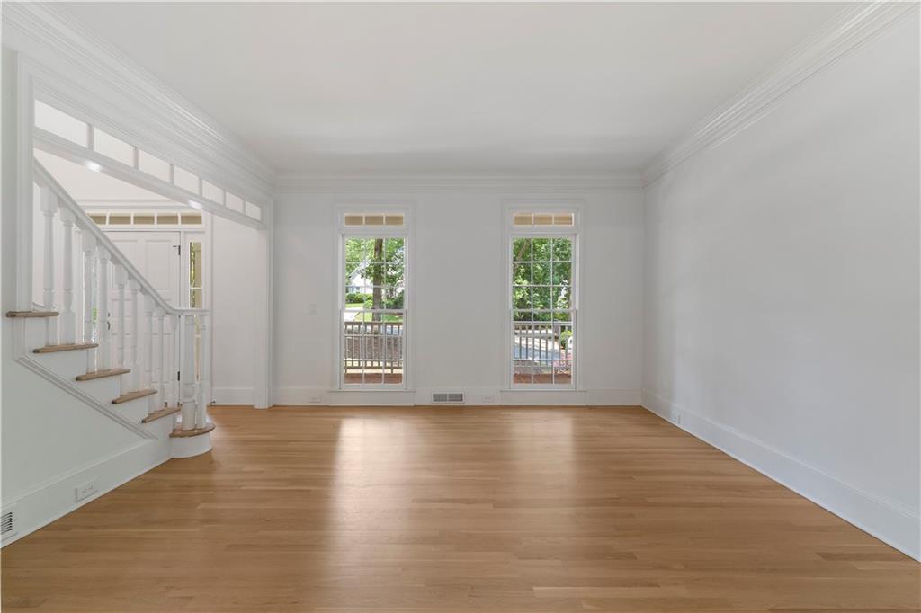 8965 Laurel Way Alpharetta, GA 30022 - Photo 21 of 79 a view of an empty room with wooden floor and a window