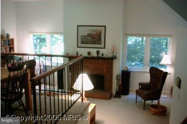 11712 Dry River Court Reston, VA 20191 - Photo 1 of 1 a living room with furniture and a fireplace