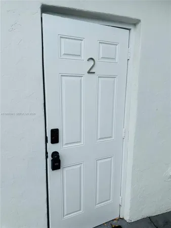 a view of bathroom with a shower and a mirror