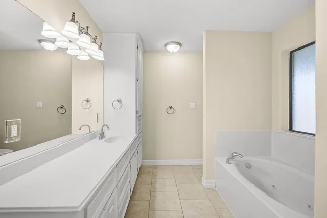 a bathroom with a sink a vanity and a mirror