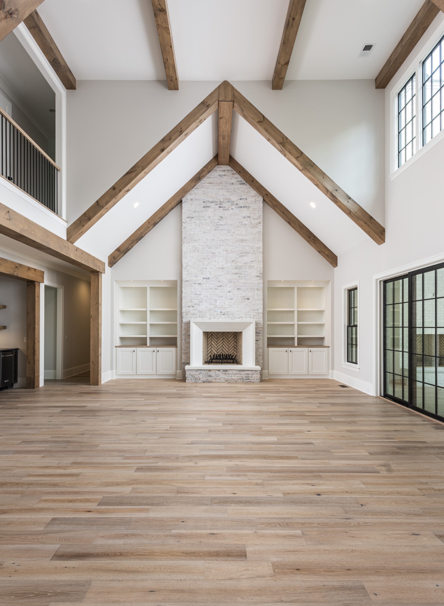 7001 Holts Reserve Road College Grove, TN 37046 - Photo 16 of 19 a view of an empty room with wooden floor and a fireplace