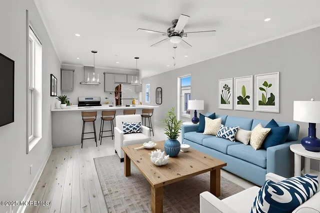 a living room with furniture and a wooden floor
