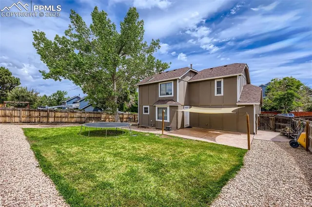 a view of a house with a yard porch and sitting area