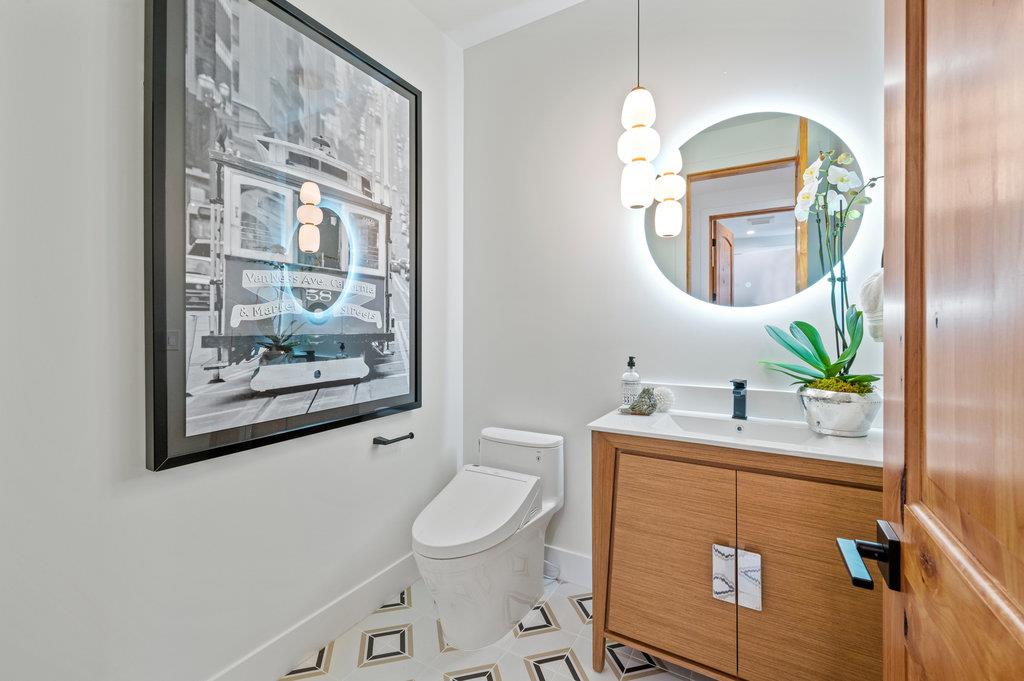 1327 Benito Avenue Burlingame, CA 94010 - Photo 18 of 41 a bathroom with a toilet a sink and a mirror