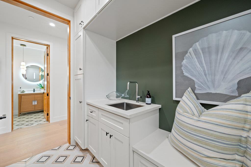 1327 Benito Avenue Burlingame, CA 94010 - Photo 19 of 41 a bathroom with a sink and mirror