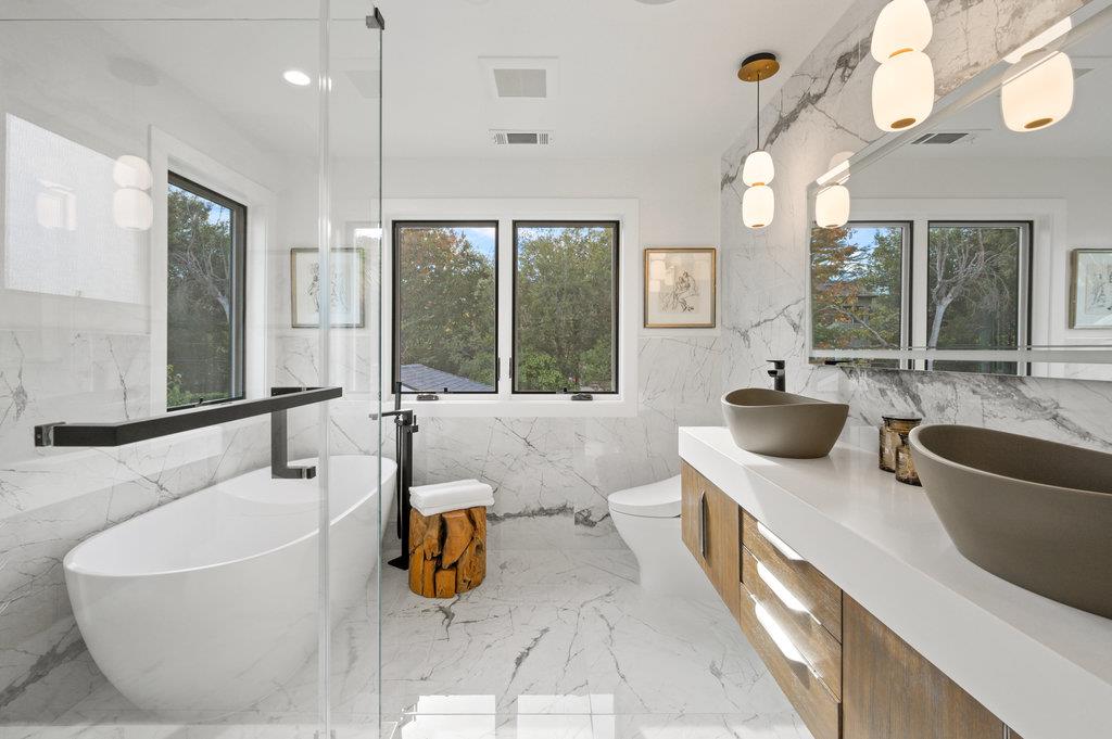 1327 Benito Avenue Burlingame, CA 94010 - Photo 27 of 41 a bathroom with a granite countertop tub a sink and a large mirror