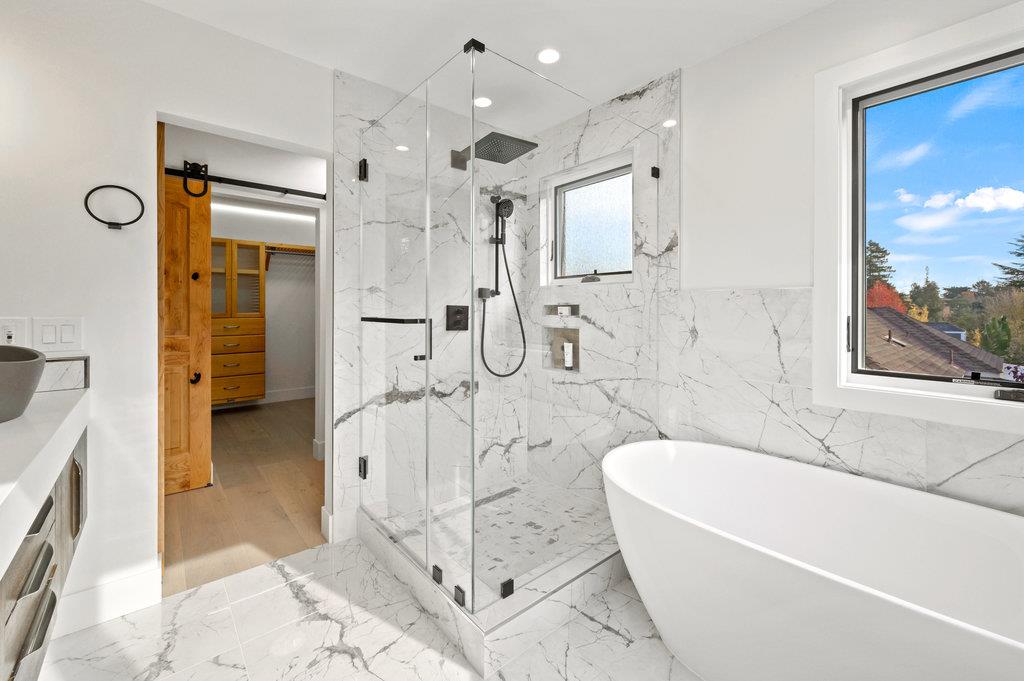 1327 Benito Avenue Burlingame, CA 94010 - Photo 28 of 41 a spacious bathroom with a tub shower and mirror