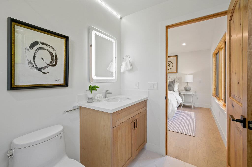 1327 Benito Avenue Burlingame, CA 94010 - Photo 36 of 41 a bathroom with a toilet a sink and mirror