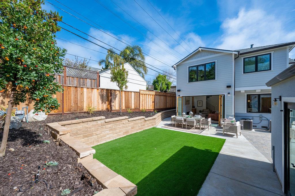 1327 Benito Avenue Burlingame, CA 94010 - Photo 40 of 41 a view of a backyard with table and chairs potted plants and a large tree