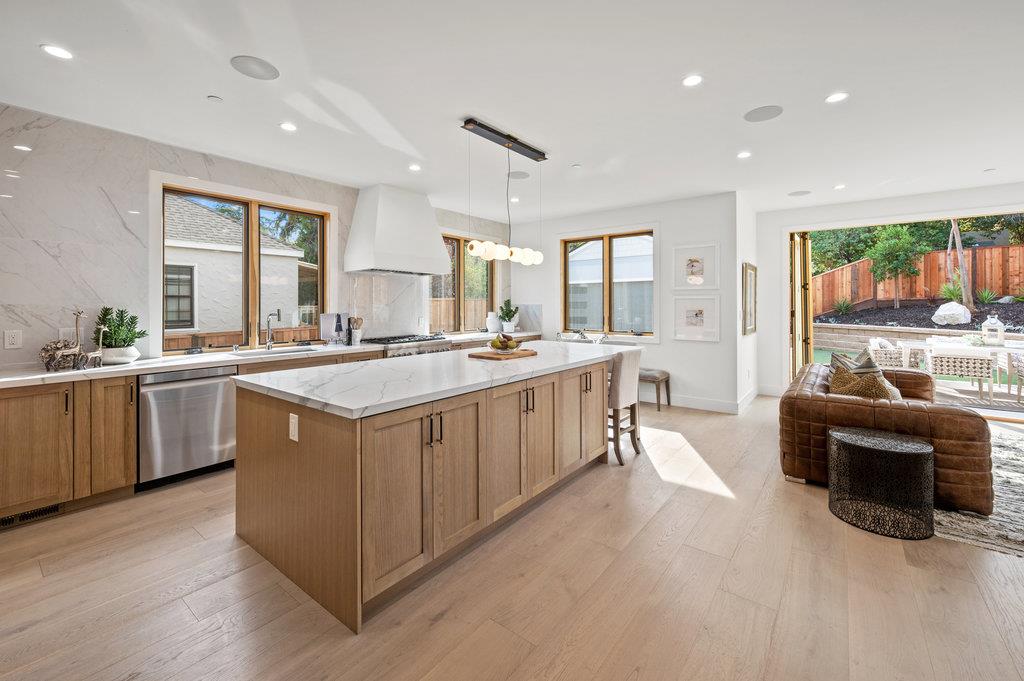 1327 Benito Avenue Burlingame, CA 94010 - Photo 8 of 41 a kitchen with a sink stove and cabinets