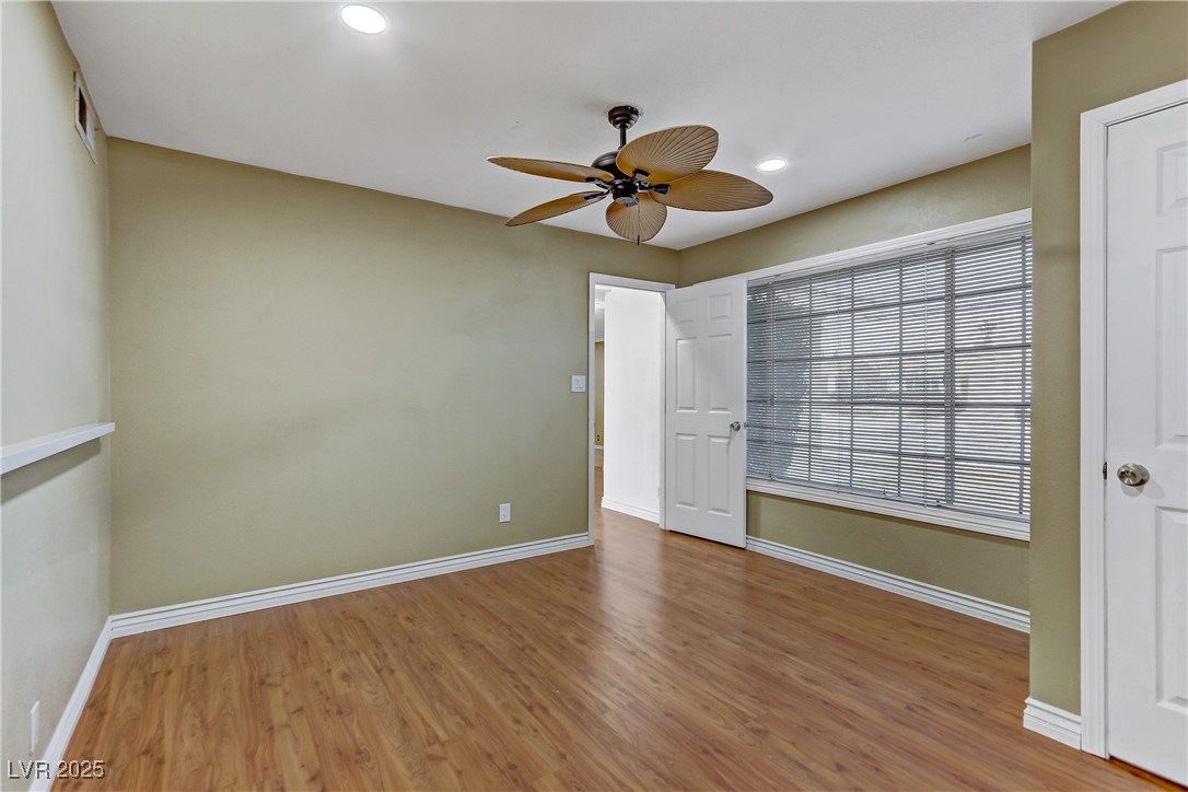 7301 Pleasant View Avenue Las Vegas, NV 89147 - Photo 14 of 37 Unfurnished bedroom with light wood-type flooring, a ceiling fan, and recessed lighting