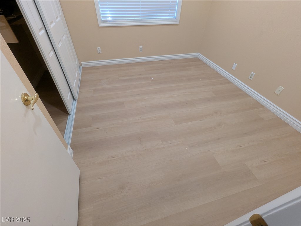 7301 Pleasant View Avenue Las Vegas, NV 89147 - Photo 18 of 37 Unfurnished bedroom with a closet and light wood-type flooring