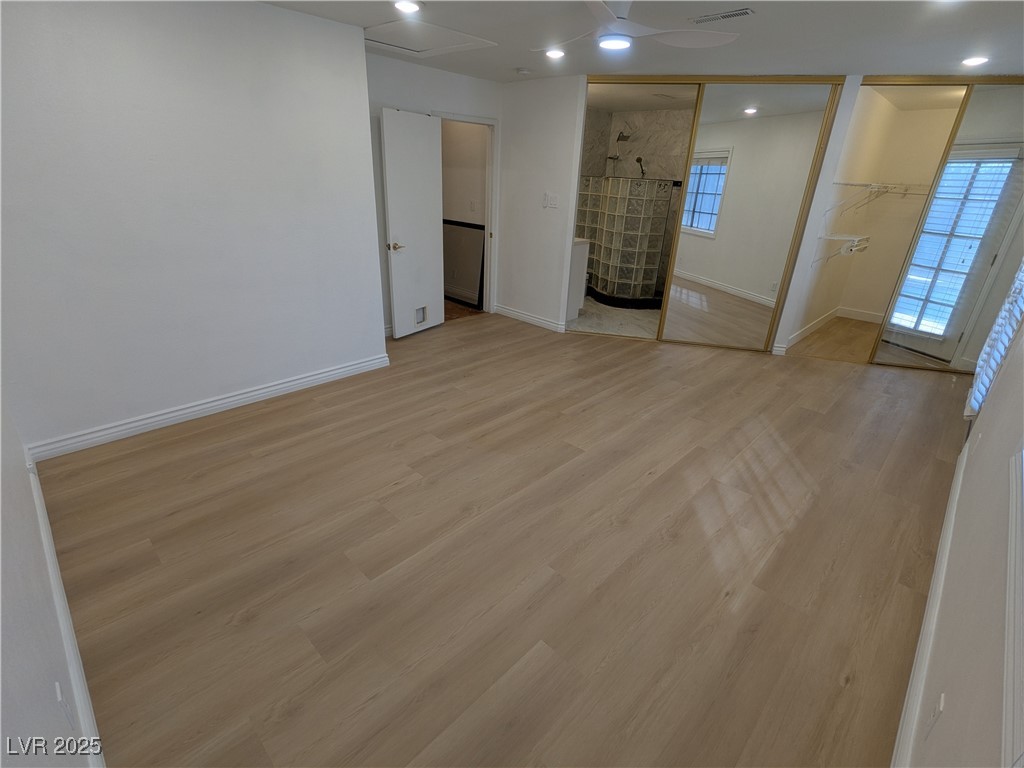 7301 Pleasant View Avenue Las Vegas, NV 89147 - Photo 25 of 37 Unfurnished bedroom with light wood-type flooring, recessed lighting, a closet, and ceiling fan