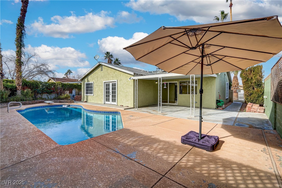 7301 Pleasant View Avenue Las Vegas, NV 89147 - Photo 37 of 37 View of pool with a patio, a fenced backyard, and a diving board