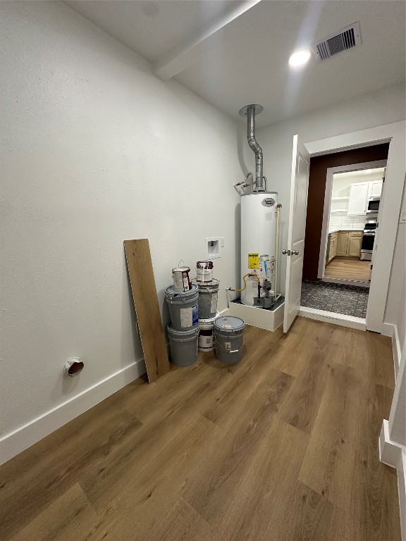 726 Banton Street Channelview, TX 77530 - Photo 29 of 30 a view of a room with gym equipment and wooden floor