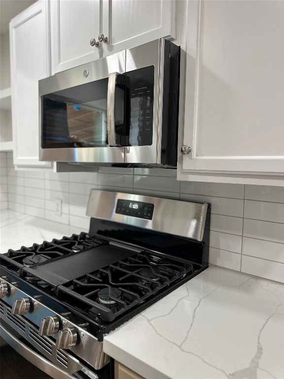 726 Banton Street Channelview, TX 77530 - Photo 8 of 30 a kitchen with a stove and a microwave