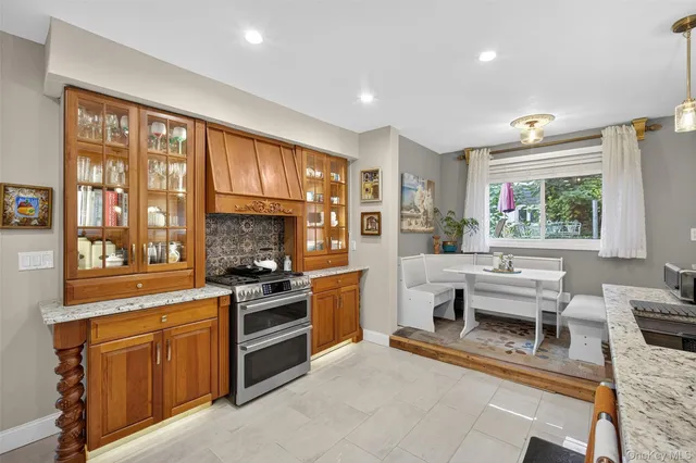 a kitchen with a stove a sink and a refrigerator