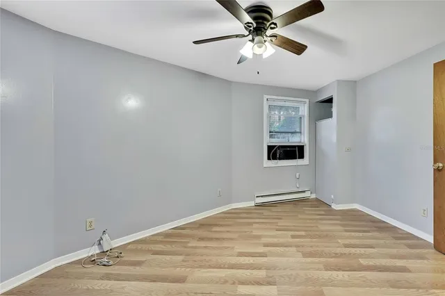 a view of a room with a ceiling fan
