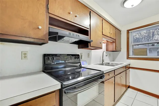 a kitchen with a stove and a sink