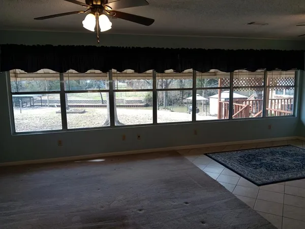 a view of a lake with boats and trees