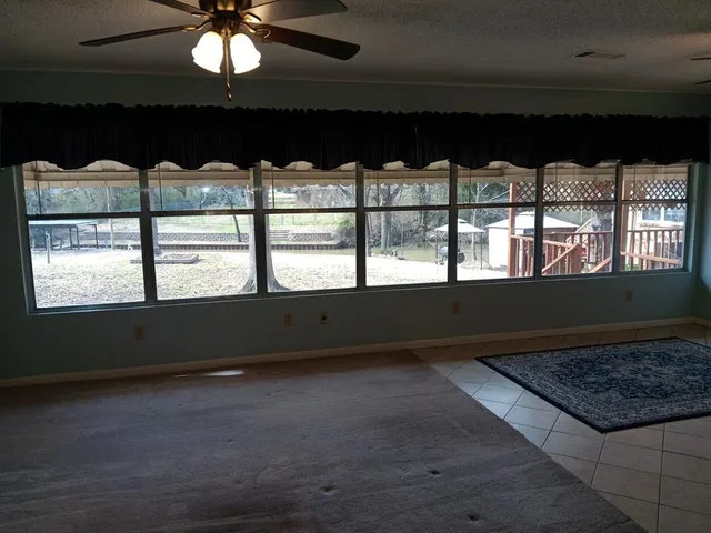 a view of a lake with boats and trees