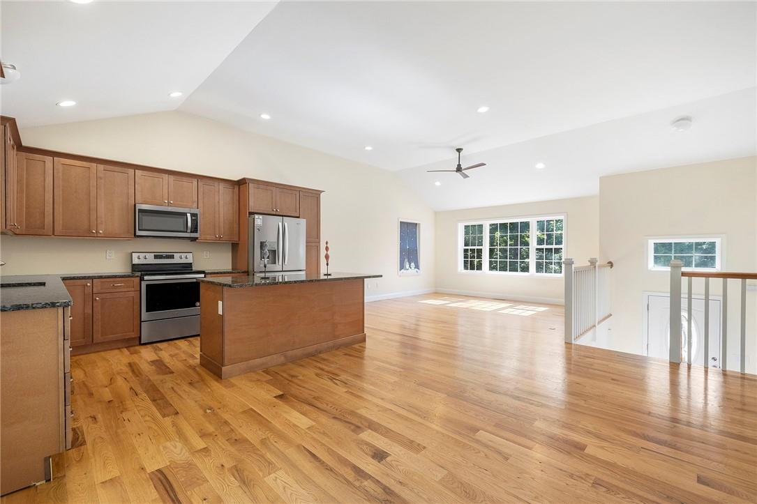 463 Nimham Road Carmel, NY 10512 - Photo 1 of 1 a large kitchen with kitchen island a sink wooden floor and stainless steel appliances