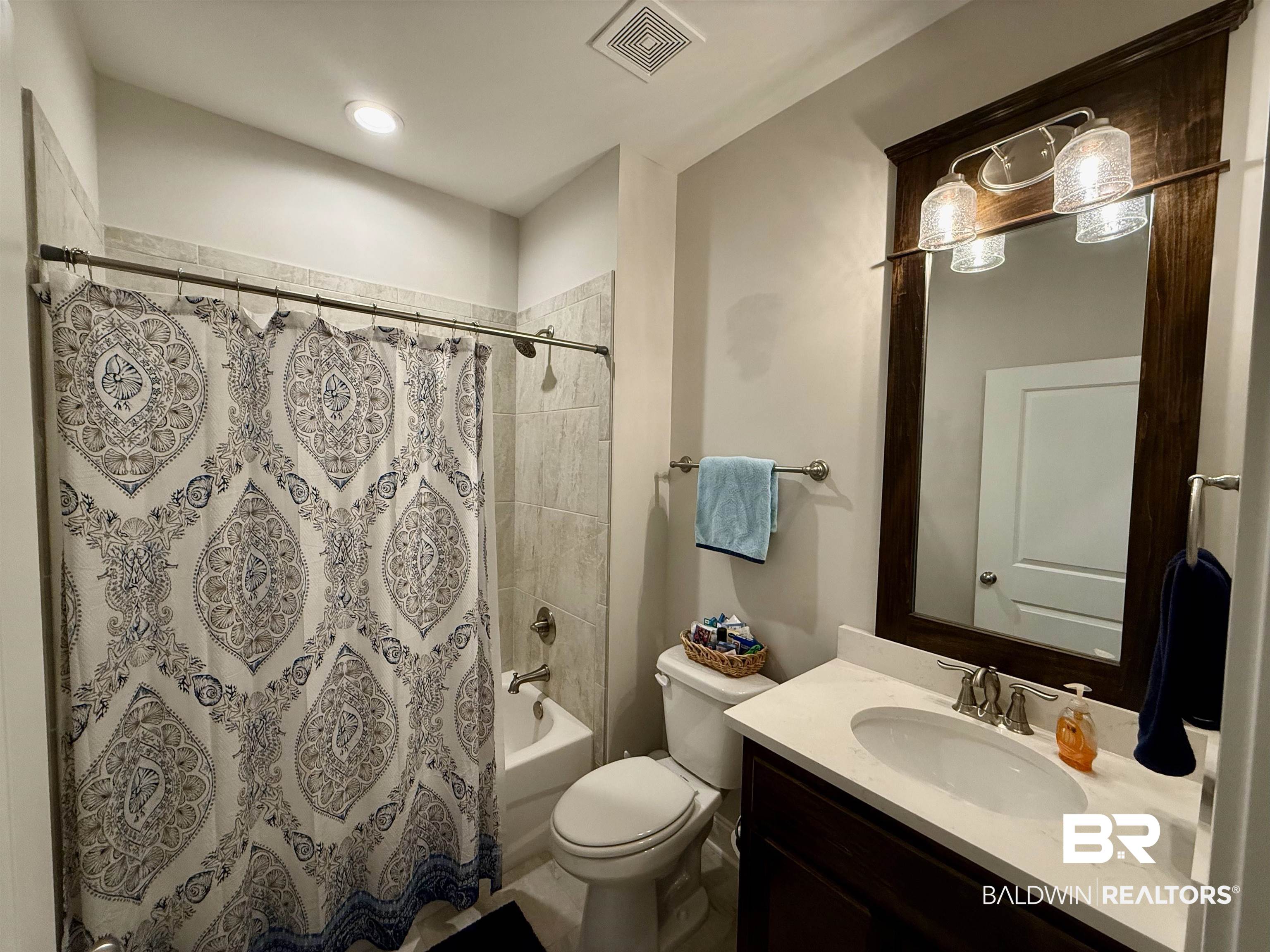 31748 Canopy Loop Spanish Fort, AL 36527 - Photo 10 of 22 Full bathroom featuring toilet, shower / bath combo with shower curtain, and vanity