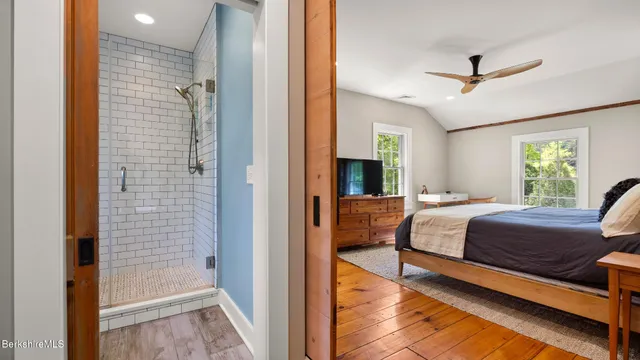 a bathroom with a toilet and a shower