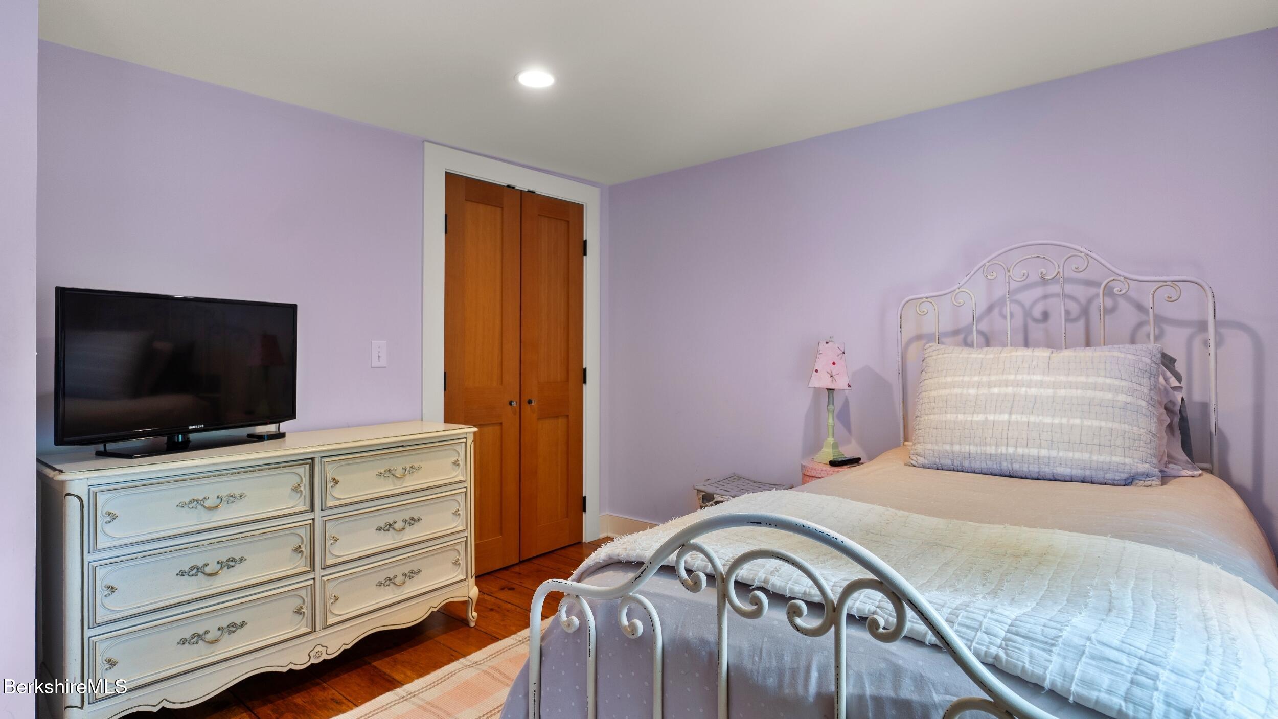 8 Yale Hill Road Stockbridge, MA 01262 - Photo 33 of 51 a bedroom with a bed and a flat screen tv