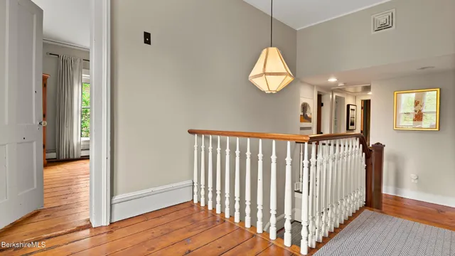 a bedroom with furniture and a large window