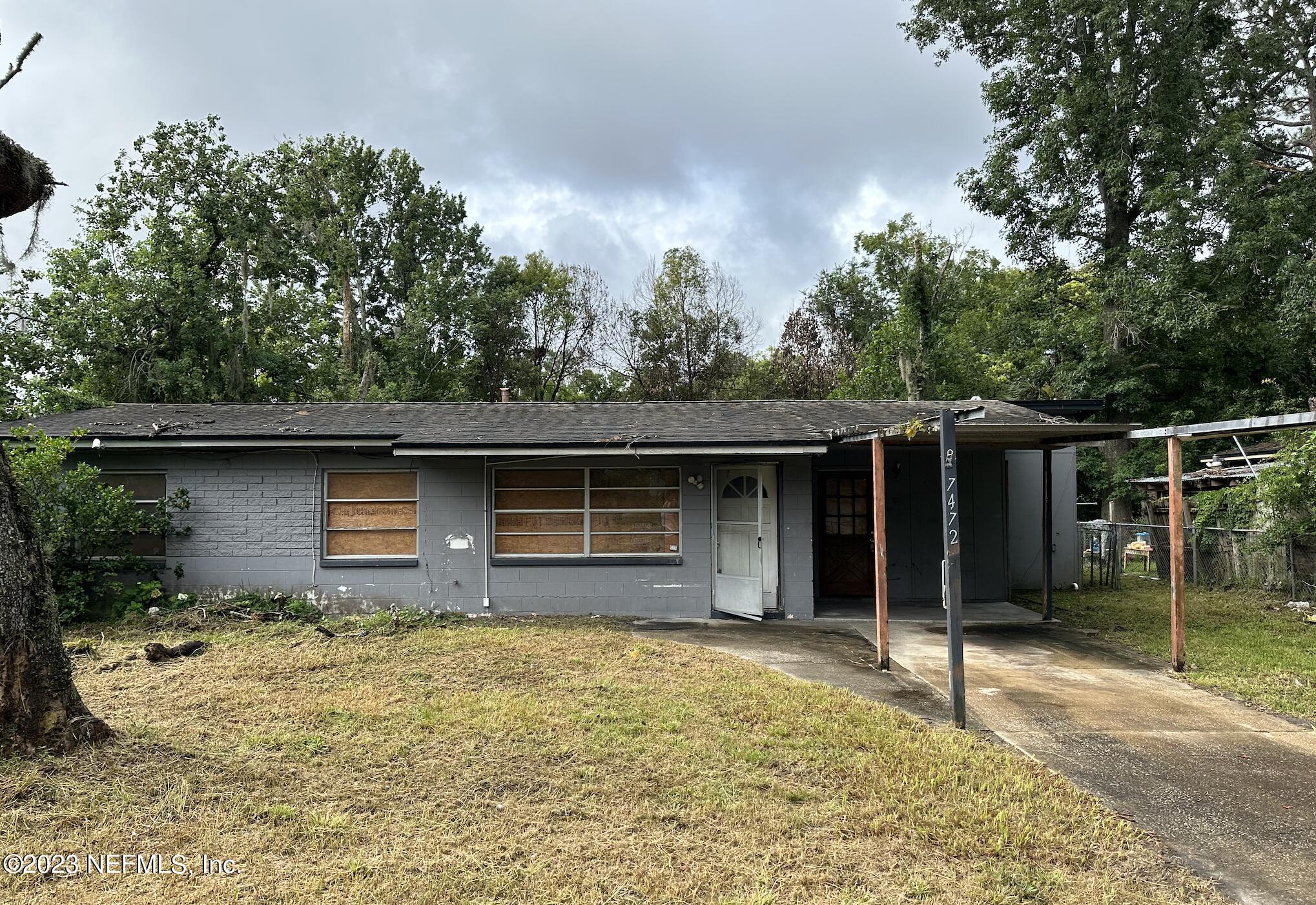 a house with trees in the background