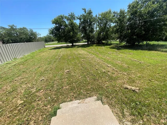 a view of a yard with a trees