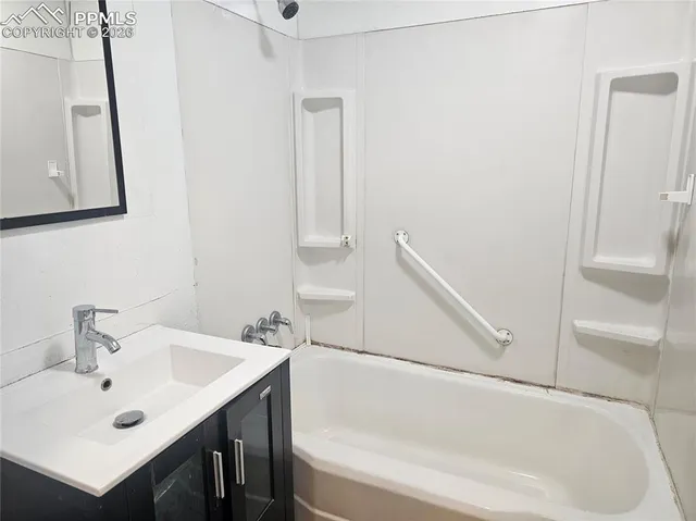 a bathroom with a sink and a bathtub