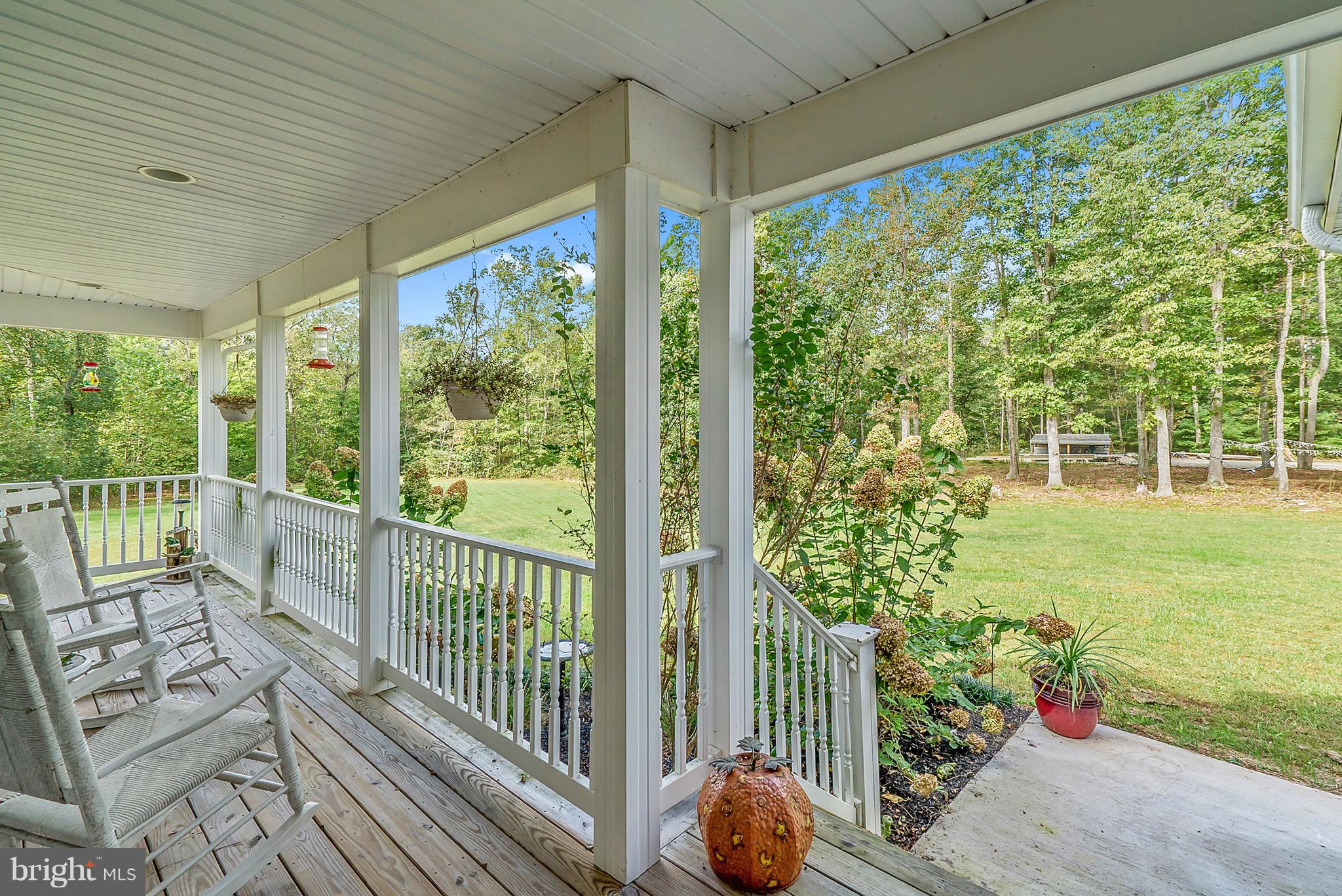 11178 Spring Hollow Lane Rixeyville, VA 22737 - Photo 9 of 30 Wrap around front porch with space for rockers!
