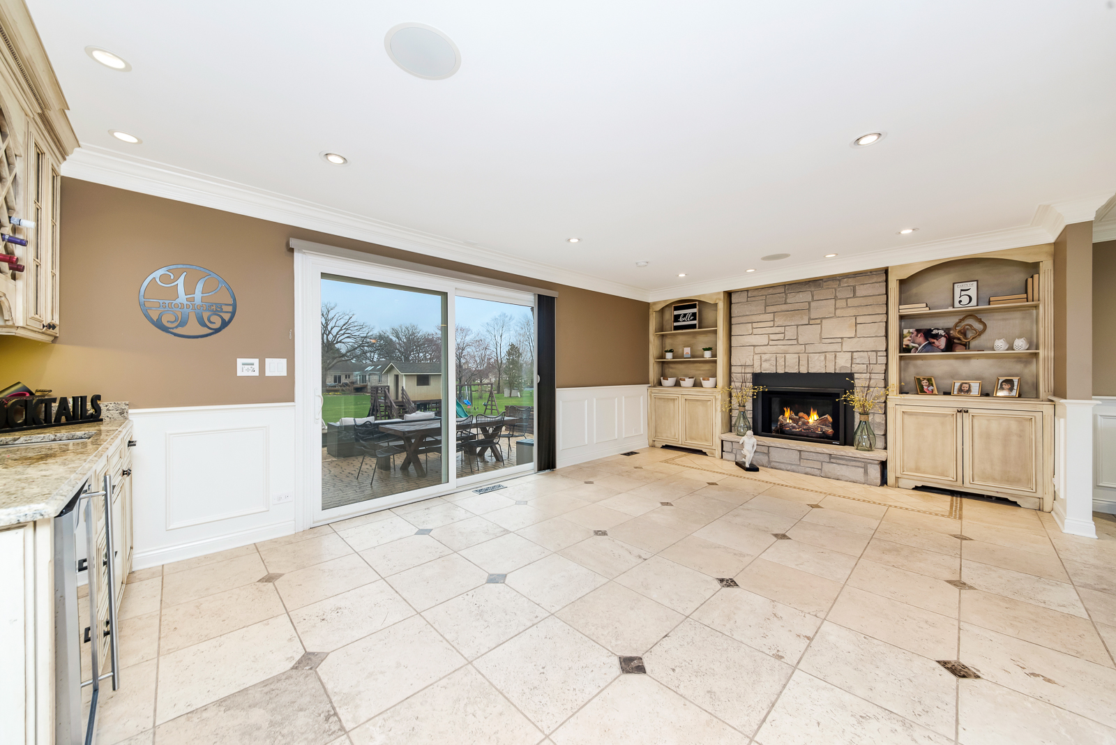 7 Sorrel Lemont, IL 60439 - Photo 11 of 36 a view of an empty room with a fireplace and a large window