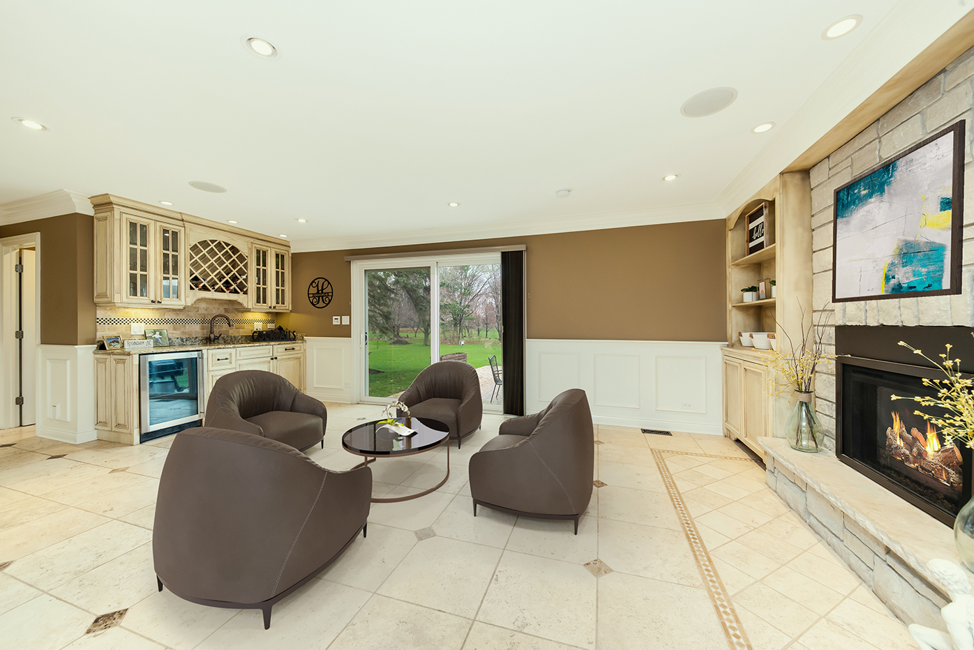 7 Sorrel Lemont, IL 60439 - Photo 13 of 36 a living room with furniture a fireplace and a floor to ceiling window