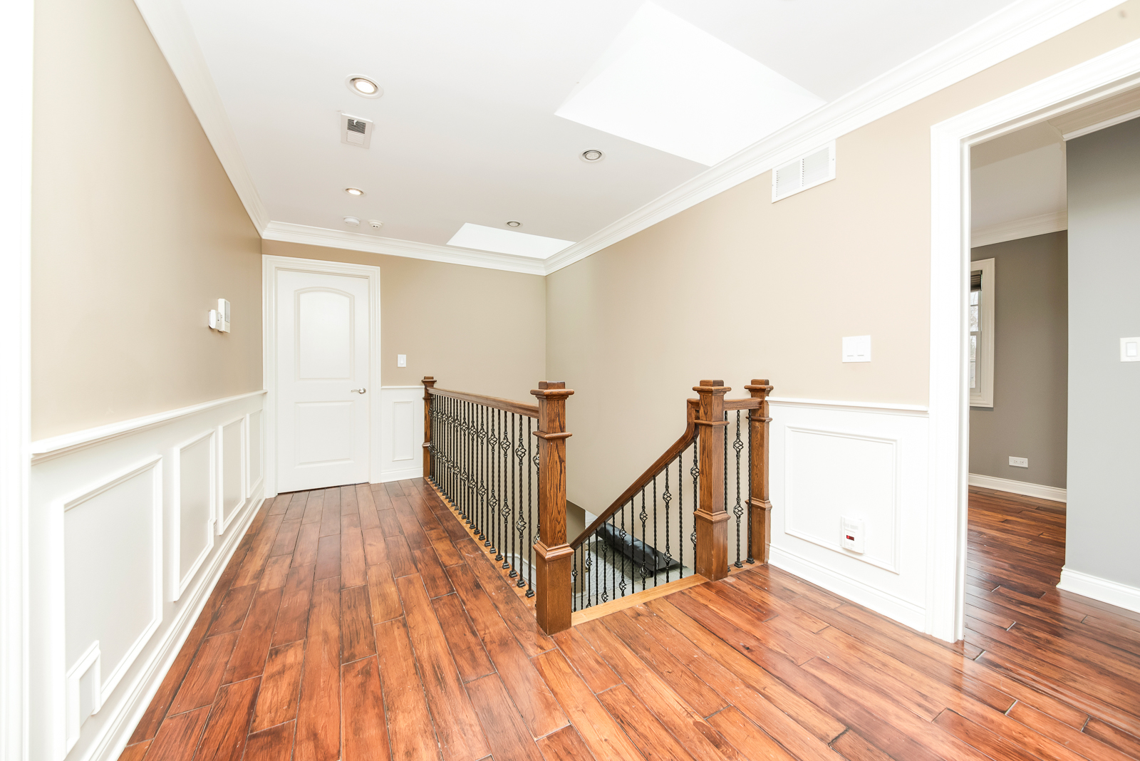 7 Sorrel Lemont, IL 60439 - Photo 22 of 36 a view of a hallway with wooden floor and staircase