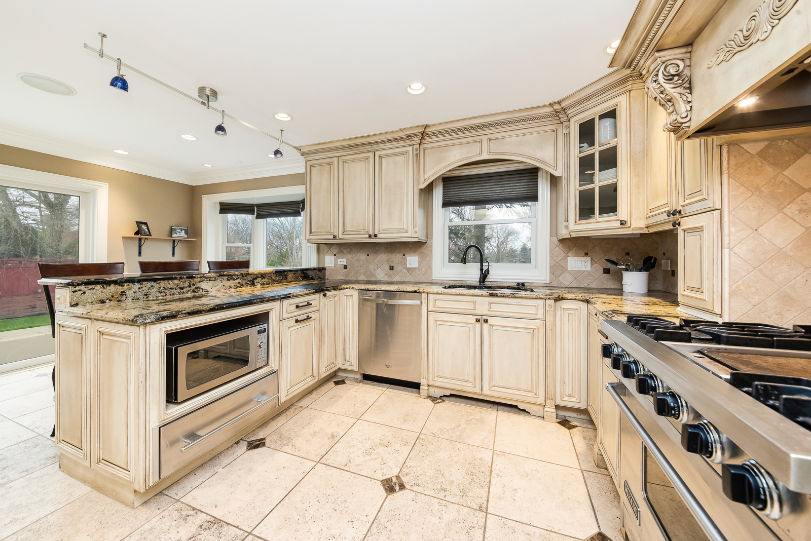 7 Sorrel Lemont, IL 60439 - Photo 7 of 36 a kitchen with stainless steel appliances granite countertop a stove and a sink