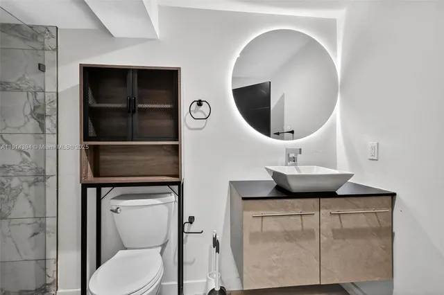 a bathroom with a toilet and a sink