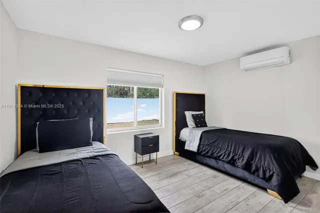 a bedroom with a bed and a fireplace