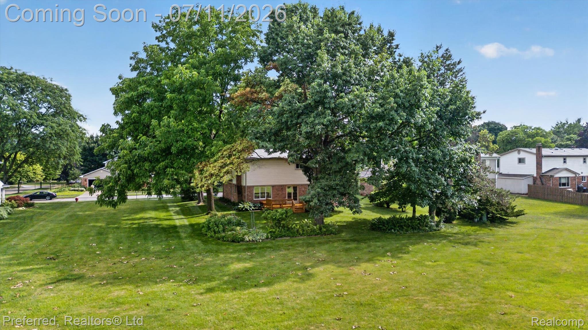 46596 Maidstone Road Canton, MI 48187 - Photo 53 of 61 Expansive green lawn with mature trees providing ample shade