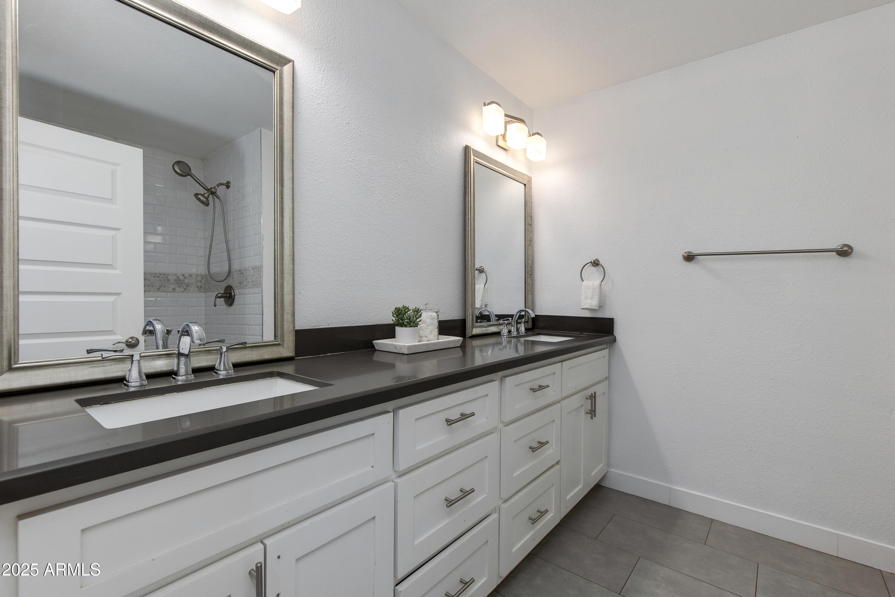 1820 West Seldon Way Phoenix, AZ 85021 - Photo 12 of 29 a bathroom with a double vanity sink and a mirror