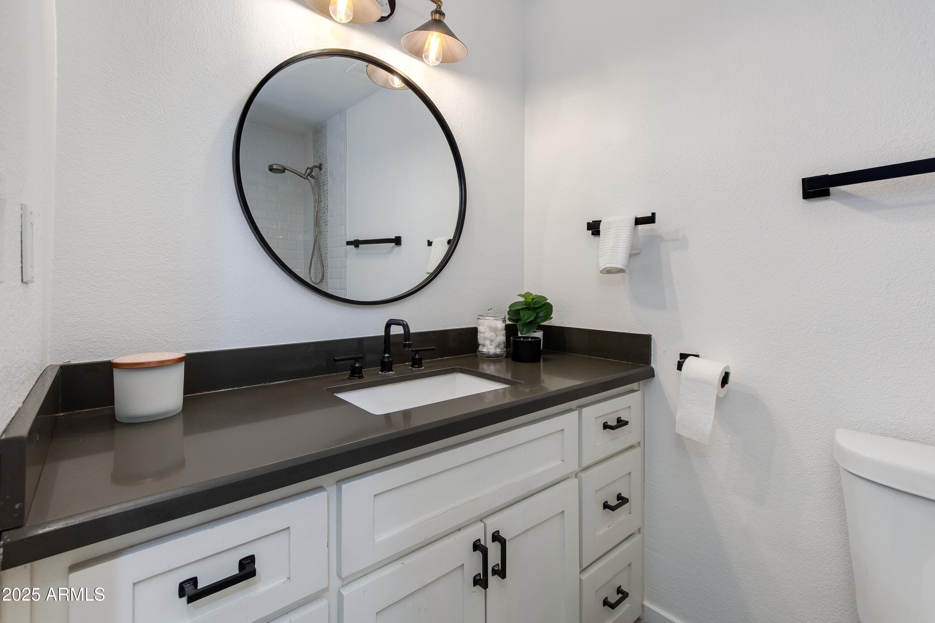 1820 West Seldon Way Phoenix, AZ 85021 - Photo 14 of 29 a bathroom with a granite countertop sink and a mirror