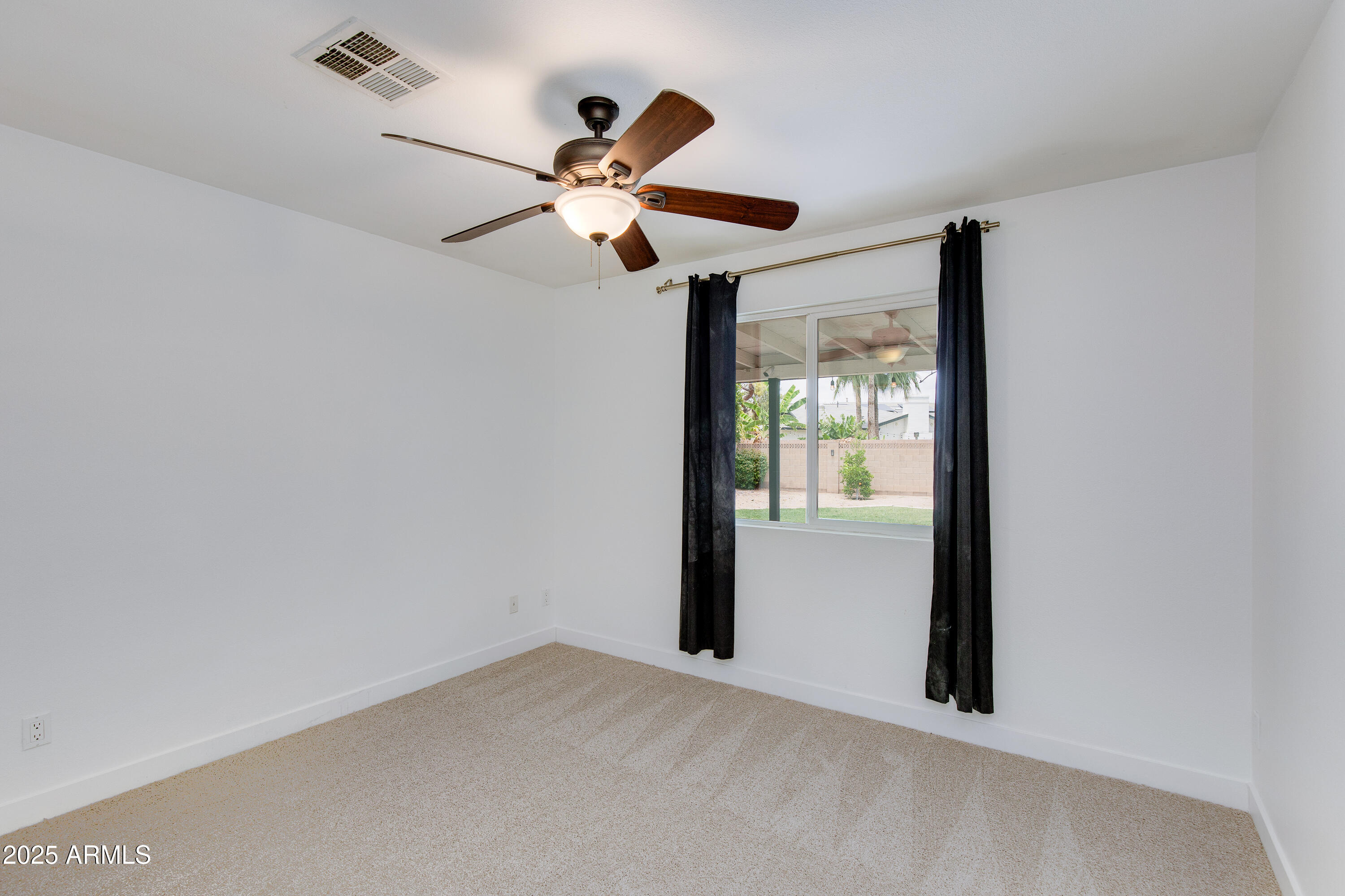 1820 West Seldon Way Phoenix, AZ 85021 - Photo 16 of 29 a view of room with window and ceiling fan